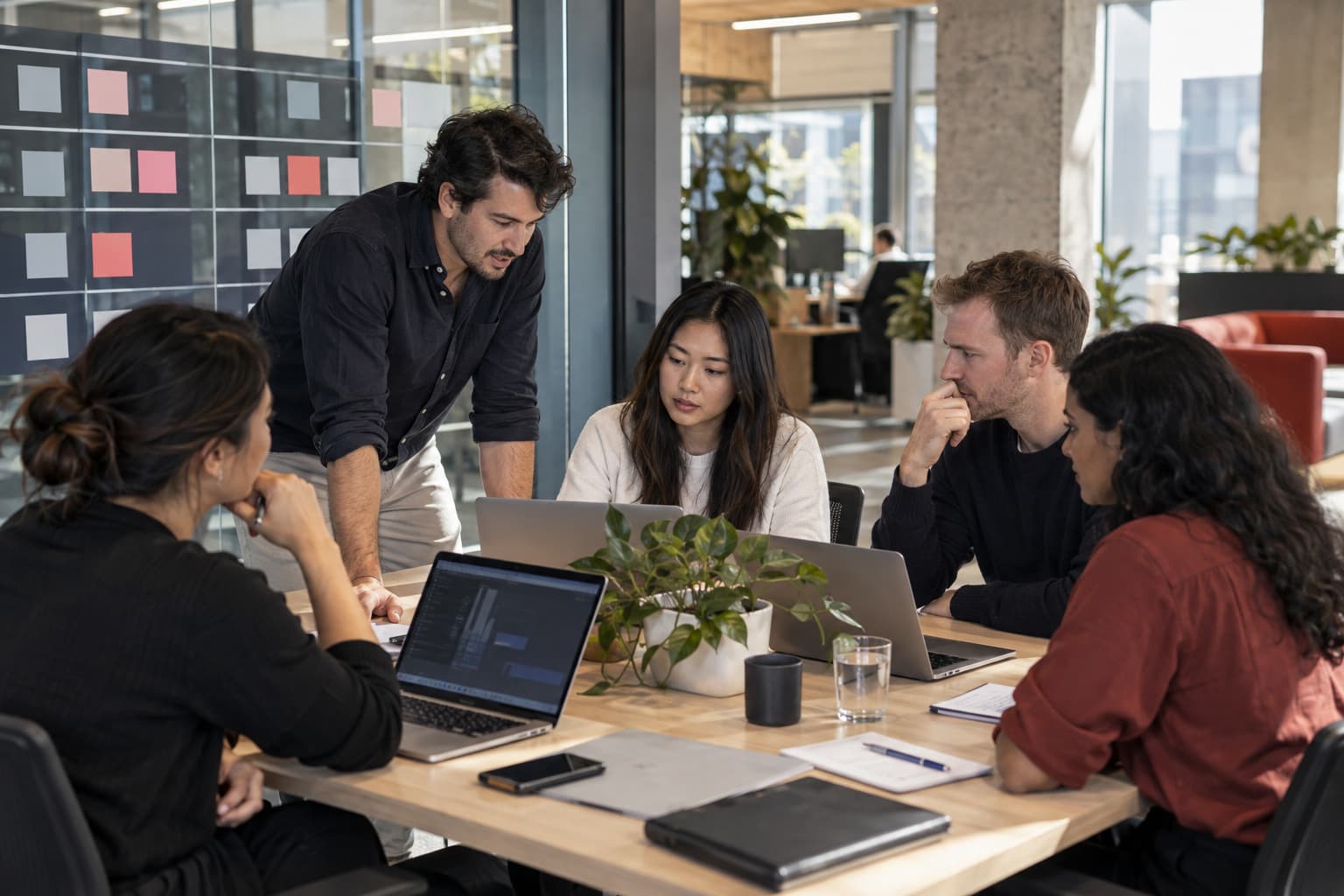 Software engineers collaborating in an Australian delivery pod
